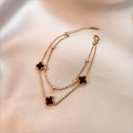 Luxury double layer golden chain anklet with black four-leaf clover charms and small beads